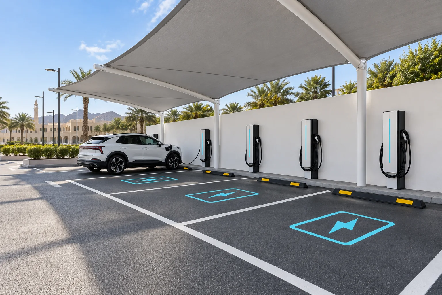 Illustrative canopy-covered business parking bays with unbranded EV chargers in Oman